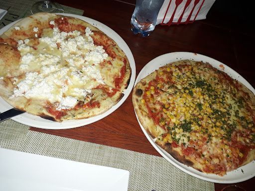 Las mejores pizzas artesanales: Pizzeria cerca de mi en Bella Vista, tu rincón de sabor inolvidable